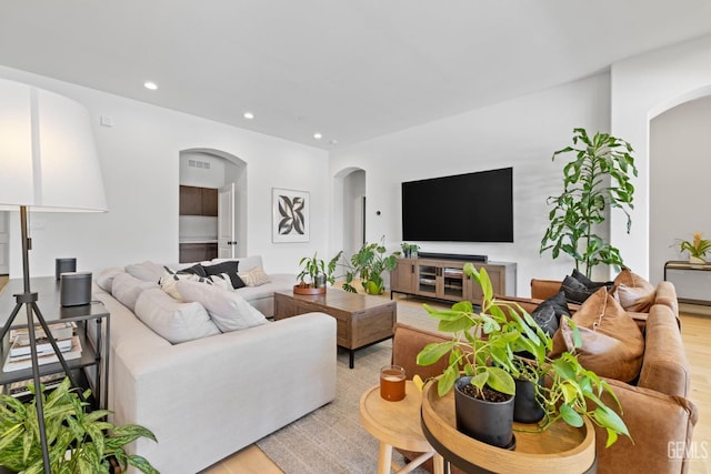 living room with light hardwood / wood-style flooring