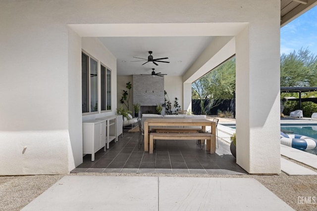 view of patio featuring ceiling fan