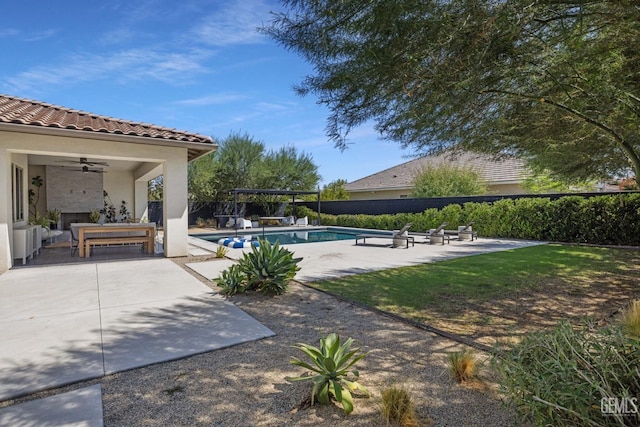 view of pool with a patio area and ceiling fan