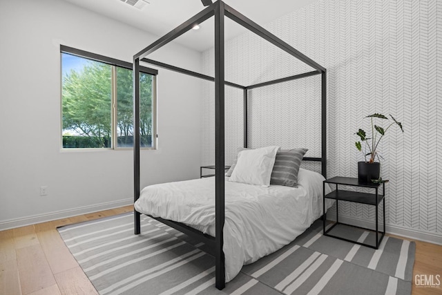 bedroom featuring hardwood / wood-style flooring