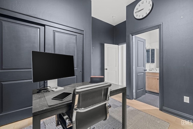 home office featuring light hardwood / wood-style flooring