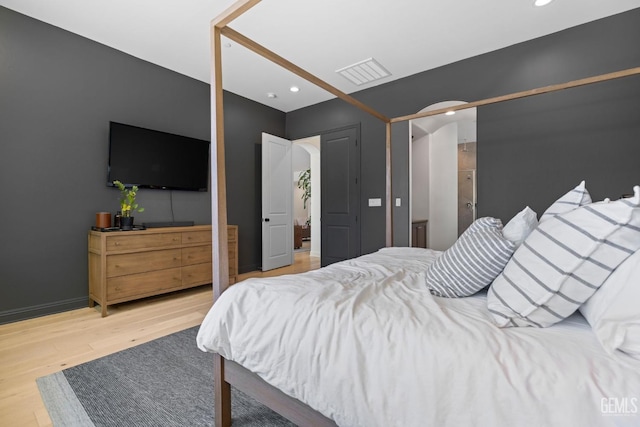 bedroom featuring hardwood / wood-style floors