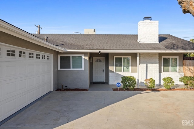 ranch-style home with a garage