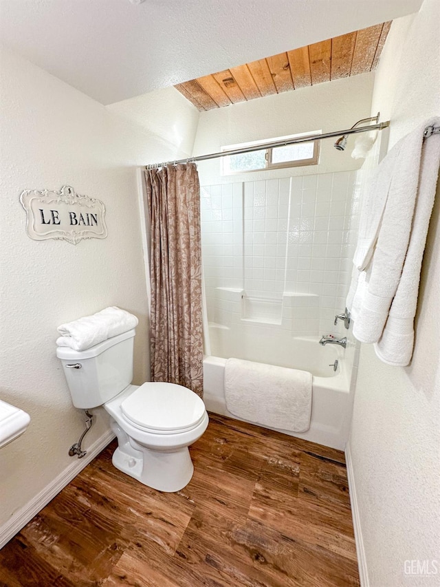 2305 Askin Ct, Pine Mountain Club, CA 93222 - full bathroom featuring wood finished floors, toilet, baseboards, and shower / tub combo