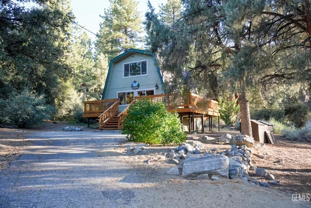 2305 Askin Ct, Pine Mountain Club, CA 93222 - a-frame home featuring a gambrel roof and a wooden deck