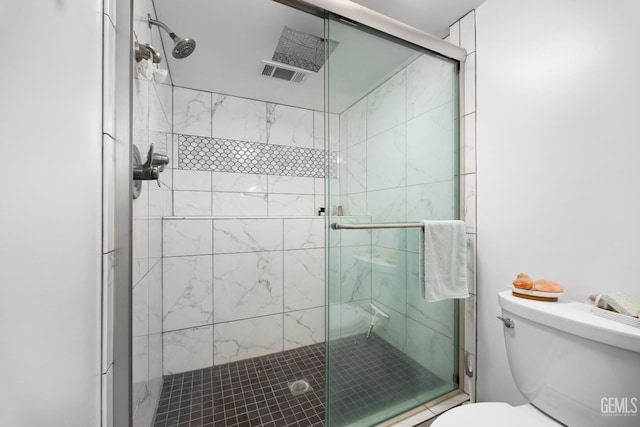 bathroom with toilet and walk in shower