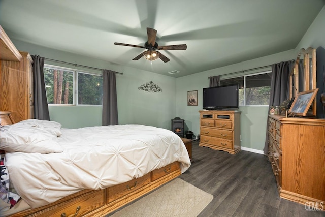 bedroom featuring ceiling fan and dark hardwood / wood-style floors