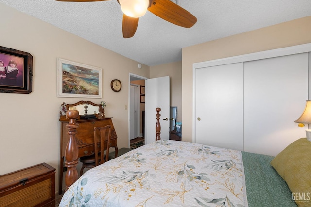 bedroom featuring a textured ceiling, a closet, and ceiling fan