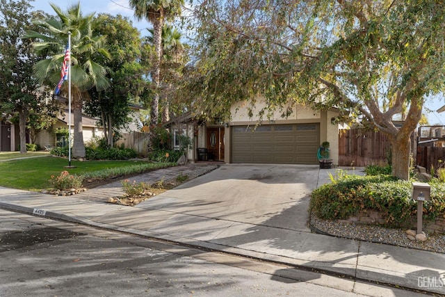 obstructed view of property featuring a front lawn