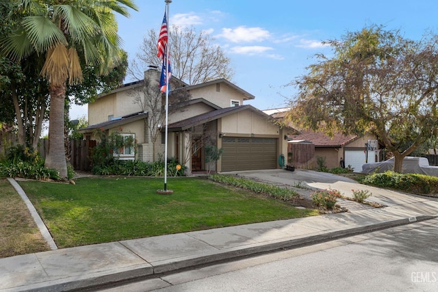 view of front of house with a garage and a front lawn