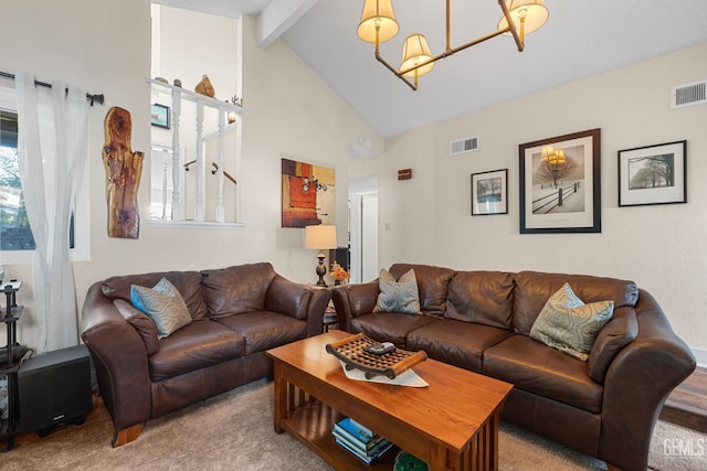 living room with vaulted ceiling with beams, carpet floors, and a chandelier