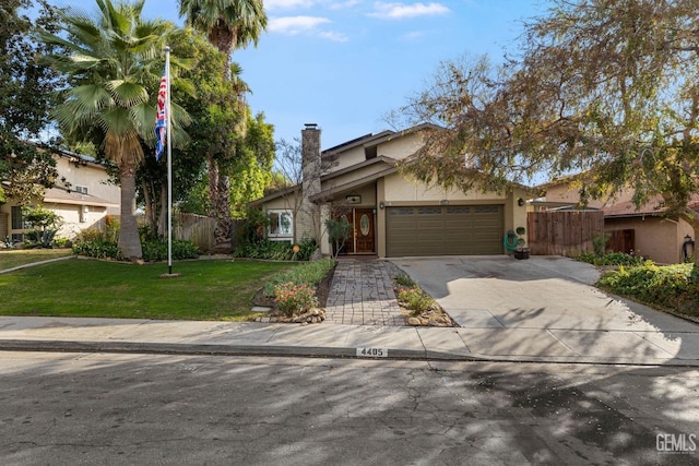 view of front facade featuring a garage and a front yard