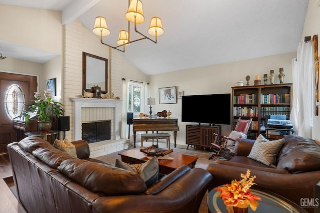 living room with hardwood / wood-style floors, vaulted ceiling with beams, a chandelier, and a brick fireplace