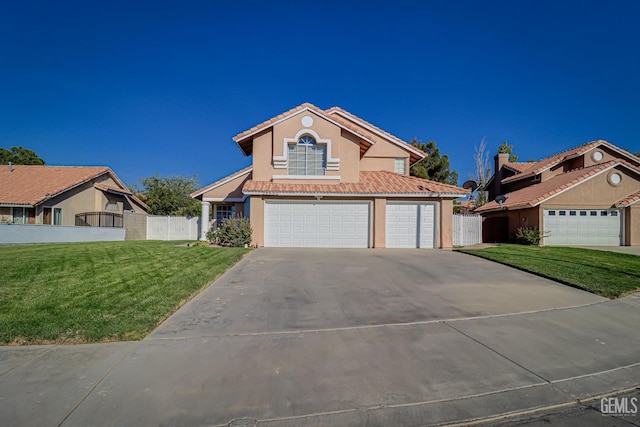 view of front of home with a front yard and a garage