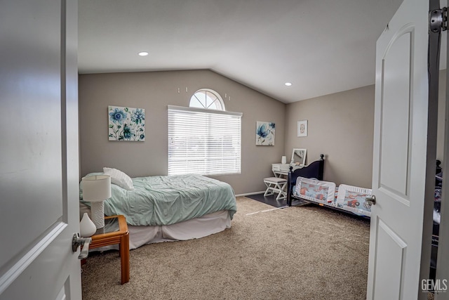 carpeted bedroom featuring vaulted ceiling