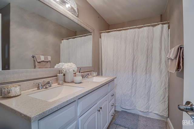 bathroom with vanity and walk in shower