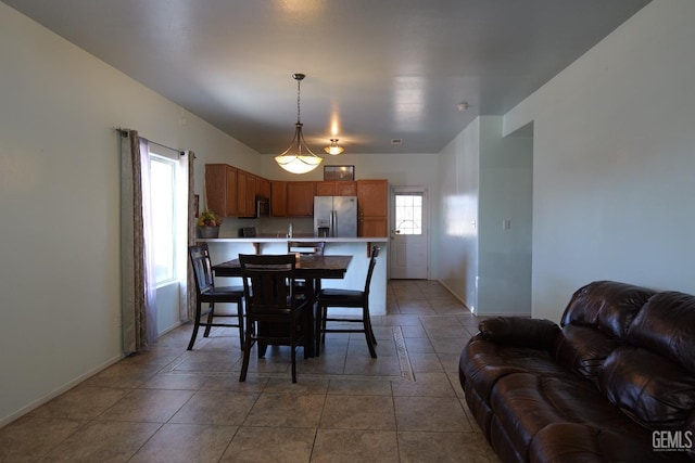 9917 Lenore St, Lamont, CA 93241 - dining room featuring baseboards and light tile patterned floors