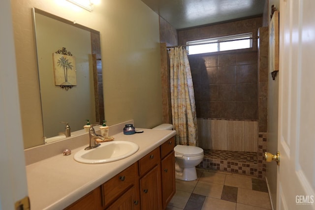 9917 Lenore St, Lamont, CA 93241 - full bath with toilet, a tile shower, vanity, and tile patterned floors