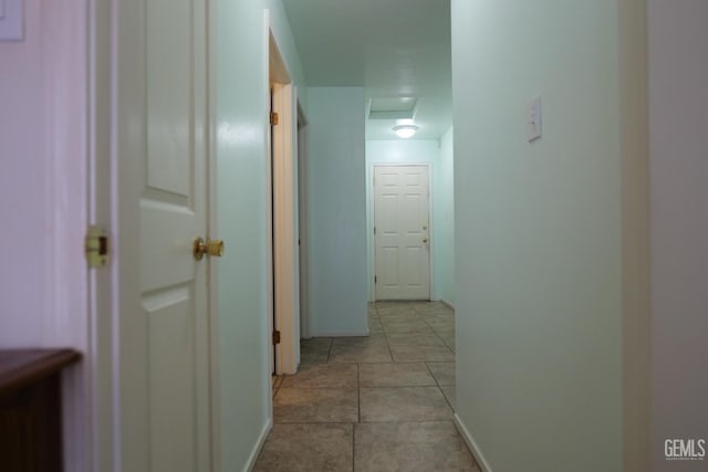 9917 Lenore St, Lamont, CA 93241 - hallway featuring attic access and light tile patterned flooring