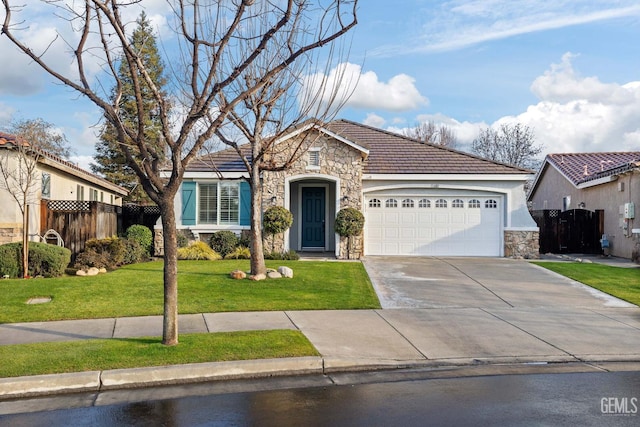 view of front of house featuring a garage and a front lawn