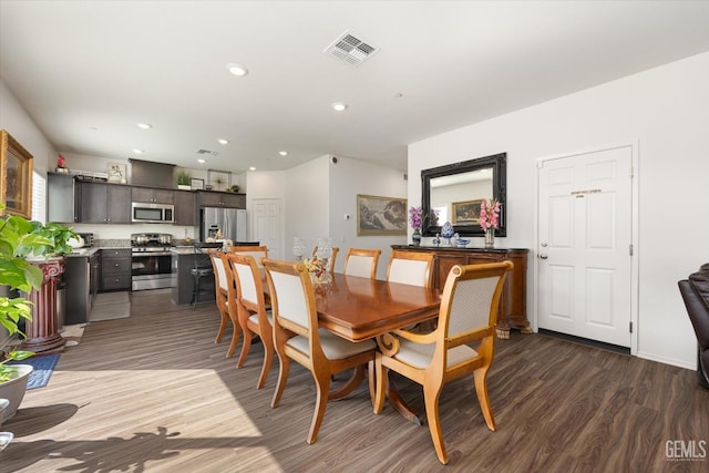 dining room with dark wood-type flooring