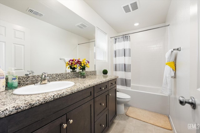 full bathroom featuring tile patterned floors, vanity, shower / tub combo, and toilet