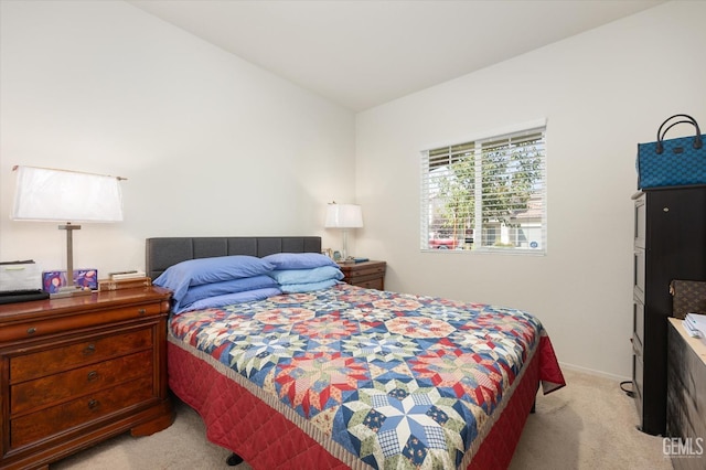 bedroom featuring light carpet