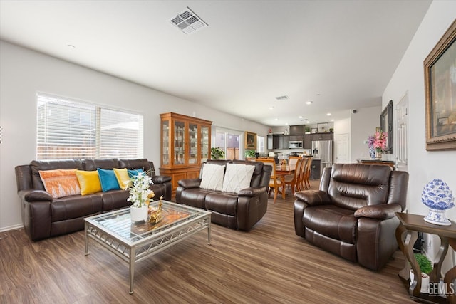 living room with dark hardwood / wood-style floors