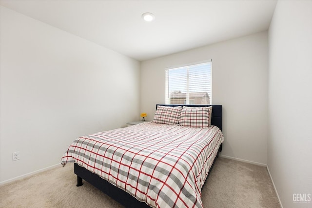 bedroom with light carpet