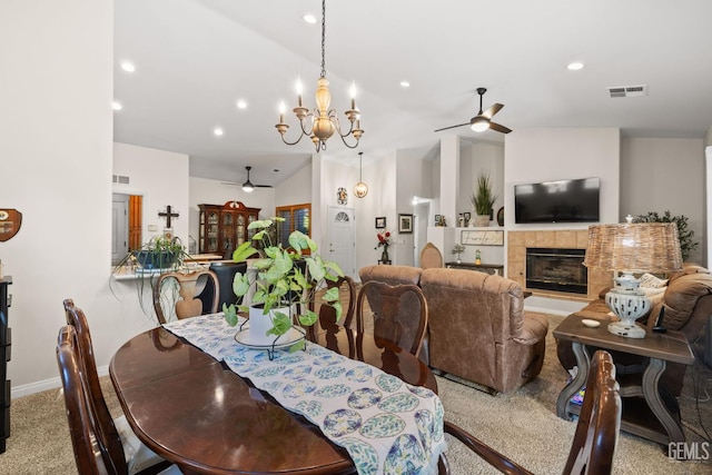 3010 Tea Rose St, Bakersfield, CA 93311 - carpeted dining area with a ceiling fan, lofted ceiling, a fireplace, recessed lighting, and a chandelier