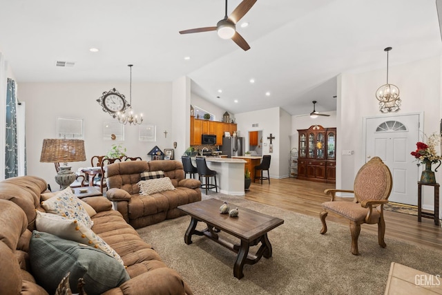 3010 Tea Rose St, Bakersfield, CA 93311 - living area featuring a ceiling fan, a chandelier, high vaulted ceiling, light wood-style floors, and recessed lighting