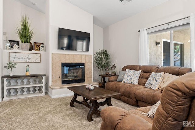 3010 Tea Rose St, Bakersfield, CA 93311 - carpeted living room featuring a fireplace and vaulted ceiling