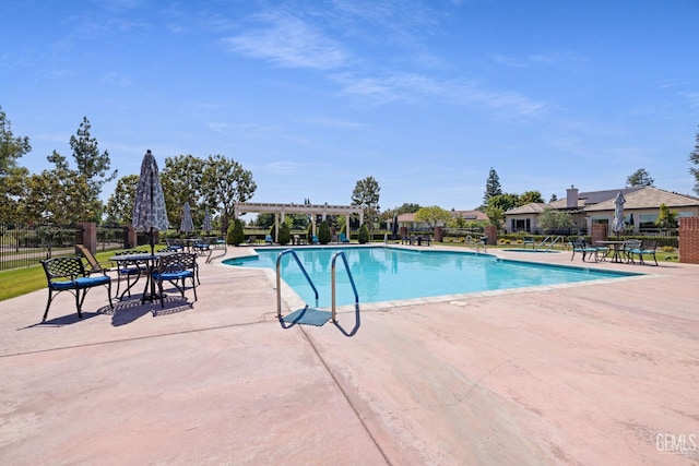 3010 Tea Rose St, Bakersfield, CA 93311 - community pool featuring a patio and a pergola