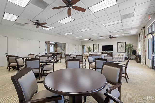 3010 Tea Rose St, Bakersfield, CA 93311 - dining space featuring a ceiling fan, light carpet, and a paneled ceiling