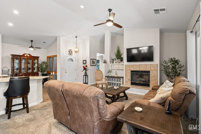 3010 Tea Rose St, Bakersfield, CA 93311 - living area with ceiling fan, vaulted ceiling, light carpet, a fireplace, and recessed lighting