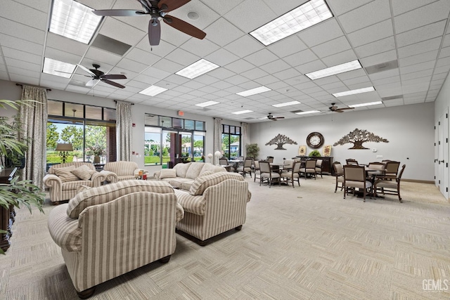 3010 Tea Rose St, Bakersfield, CA 93311 - living room featuring a ceiling fan, light carpet, and a drop ceiling