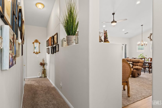 3010 Tea Rose St, Bakersfield, CA 93311 - corridor featuring a chandelier, recessed lighting, and carpet