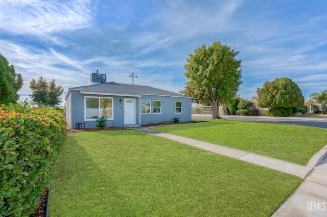 ranch-style house featuring a front lawn