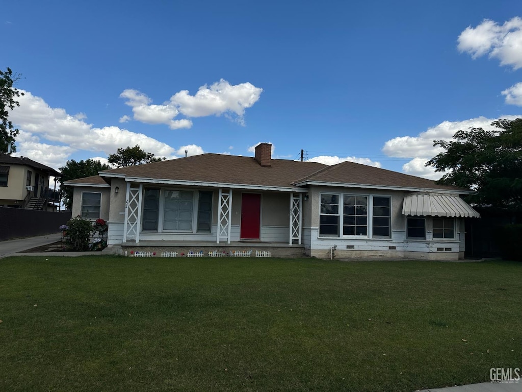 222 Brink Dr, Bakersfield, CA 93304 - view of front of home featuring a porch, a front yard, and a chimney