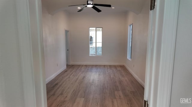 empty room with light hardwood / wood-style flooring and ceiling fan