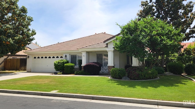 8707 Beau Maison Way, Bakersfield, CA 93311 - view of front facade with stucco siding, a tile roof, a garage, and driveway