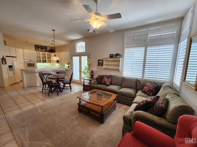 8707 Beau Maison Way, Bakersfield, CA 93311 - living room featuring light tile patterned flooring, ceiling fan, and french doors