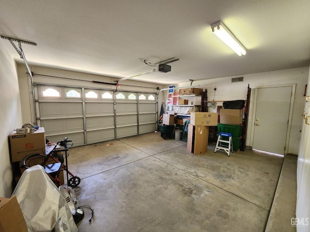 8707 Beau Maison Way, Bakersfield, CA 93311 - garage featuring a garage door opener