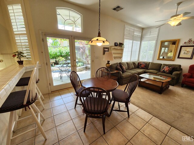 8707 Beau Maison Way, Bakersfield, CA 93311 - dining room with light tile patterned floors, ceiling fan, light carpet, and french doors