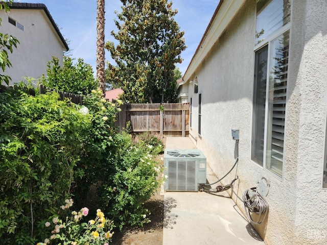 8707 Beau Maison Way, Bakersfield, CA 93311 - view of yard featuring central AC unit and a patio
