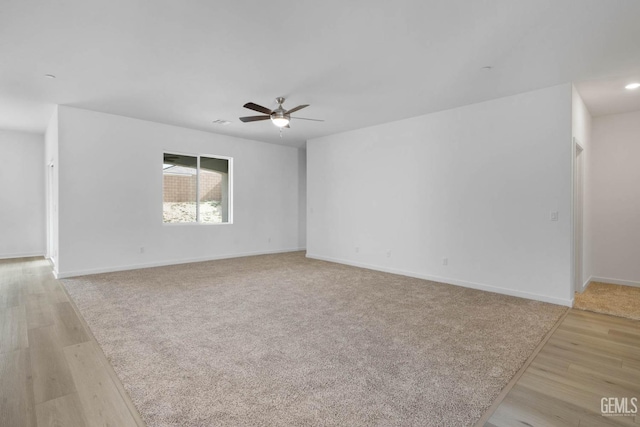 unfurnished room featuring light wood-style floors, recessed lighting, baseboards, and a ceiling fan