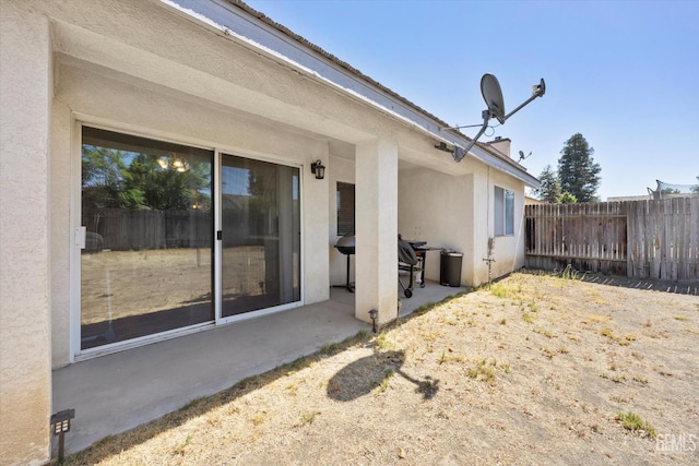 7507 Hidden Bridge Dr, Bakersfield, CA 93313 - exterior space with stucco siding and a patio area