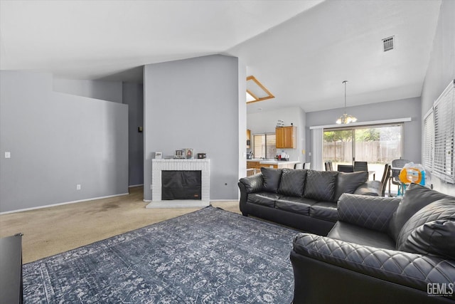 7507 Hidden Bridge Dr, Bakersfield, CA 93313 - living room featuring light carpet, a brick fireplace, a chandelier, and vaulted ceiling