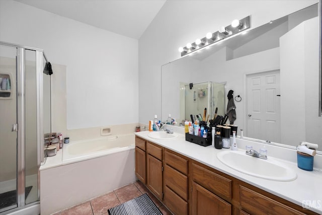 7507 Hidden Bridge Dr, Bakersfield, CA 93313 - bathroom featuring a stall shower, double vanity, a bath, and vaulted ceiling