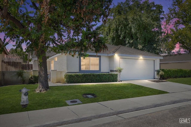 7507 Hidden Bridge Dr, Bakersfield, CA 93313 - view of front of house featuring stucco siding, a garage, driveway, and a tile roof